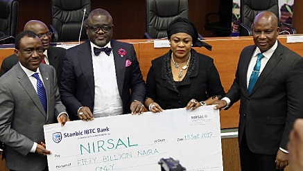 Officials of NIRSAL and Stanbic IBTC at the agreement signing, recently.